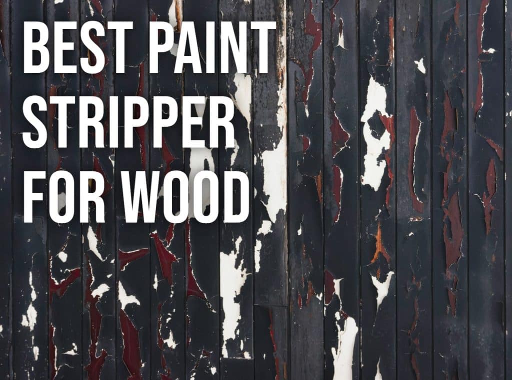 Weathered wooden boards with layers of old paint flaking off