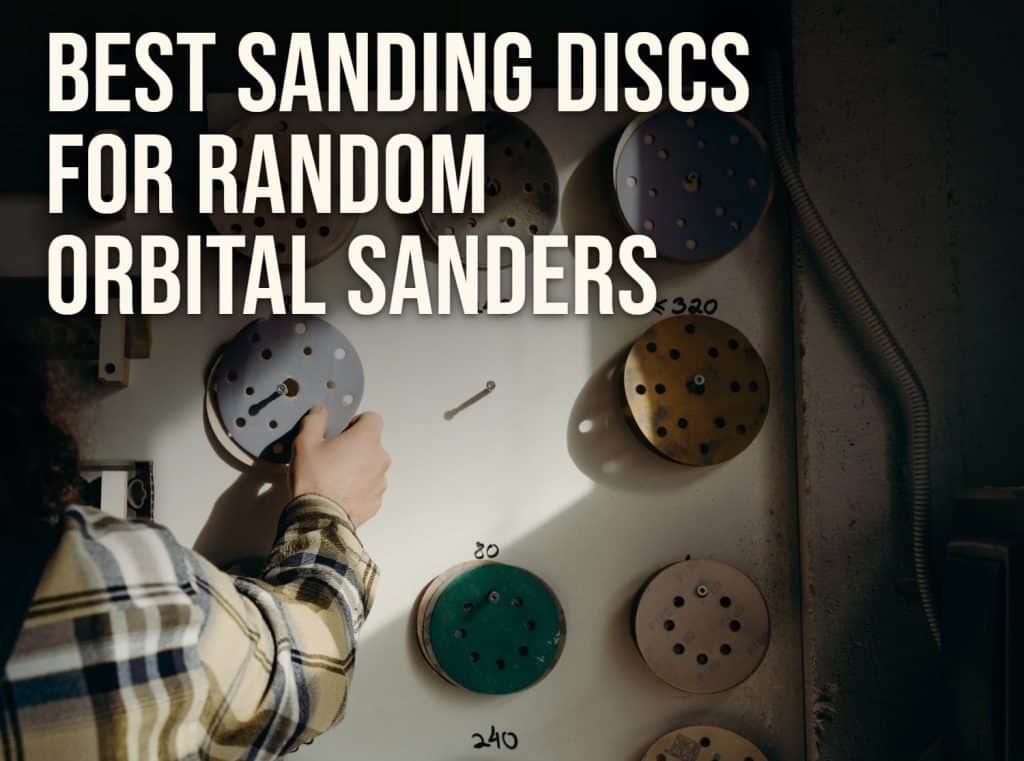 Best sanding discs for random orbital sanders: hook-and-loop discs sorted by grit on a workshop wall