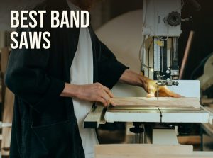 Best band saw for woodworking: a woodworker feeding a board through a band saw blade