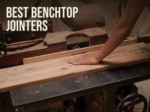 Best benchtop jointers: flattening a board on a jointer with wood chips on the table