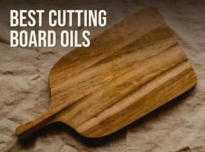 Best cutting board oil: a wooden cutting board with a handle on a linen cloth