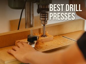 Best drill press: a woodworker boring a hole with a Forstner bit on a drill press with a hold-down clamp