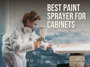 Best paint sprayer for cabinets: spraying a cabinet panel with an HVLP spray gun