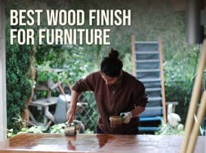 Best wood finish for furniture: brushing a clear finish onto a wooden tabletop