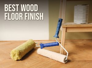 Best wood floor finish: paint rollers and a can of finish on a wood floor