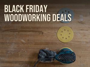 Black Friday woodworking deals: random orbital sander and hook-and-loop sanding discs on a workbench