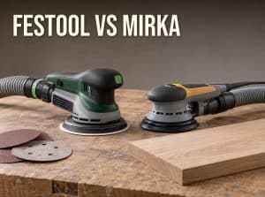 Festool vs Mirka: two 5-inch random orbital sanders, one green and one gray and yellow, on an oak board with hook-and-loop sanding discs