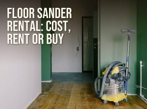 Floor sander rental: a room under renovation with bare wood floorboards and a dust extractor ready for sanding