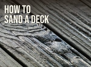 How to sand a deck: weathered gray deck boards with raised grain that need sanding before stain