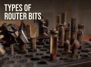 Types of router bits: a rack of used router bits in a woodworking shop